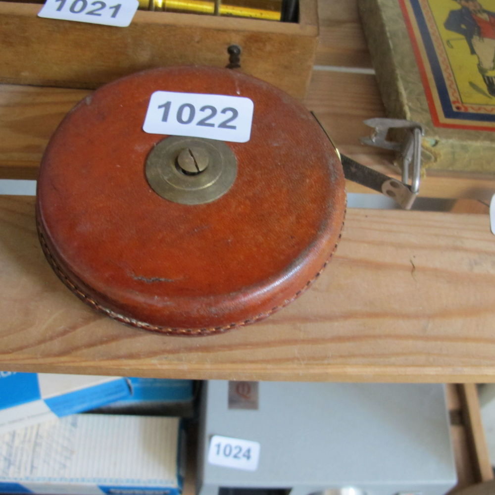 Lot 1022: Vintage leather bound measuring tape