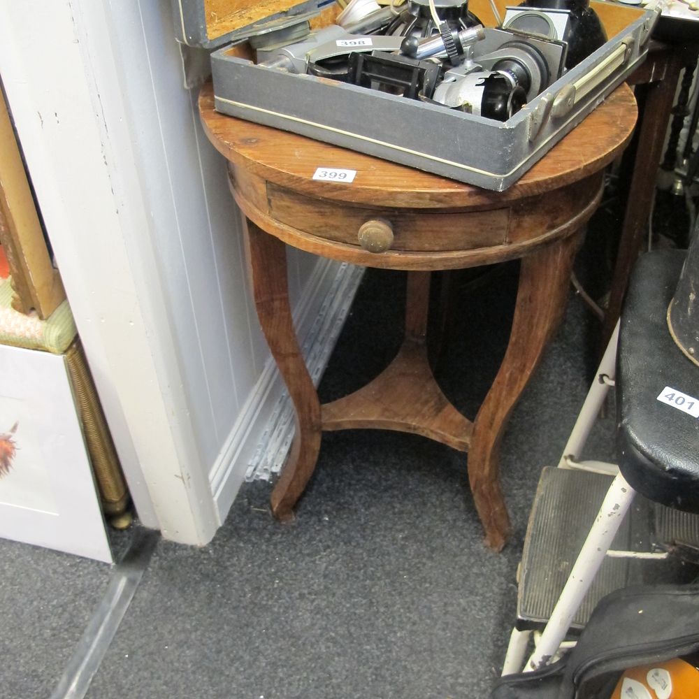 Lot 399: Round wooden table with drawer 