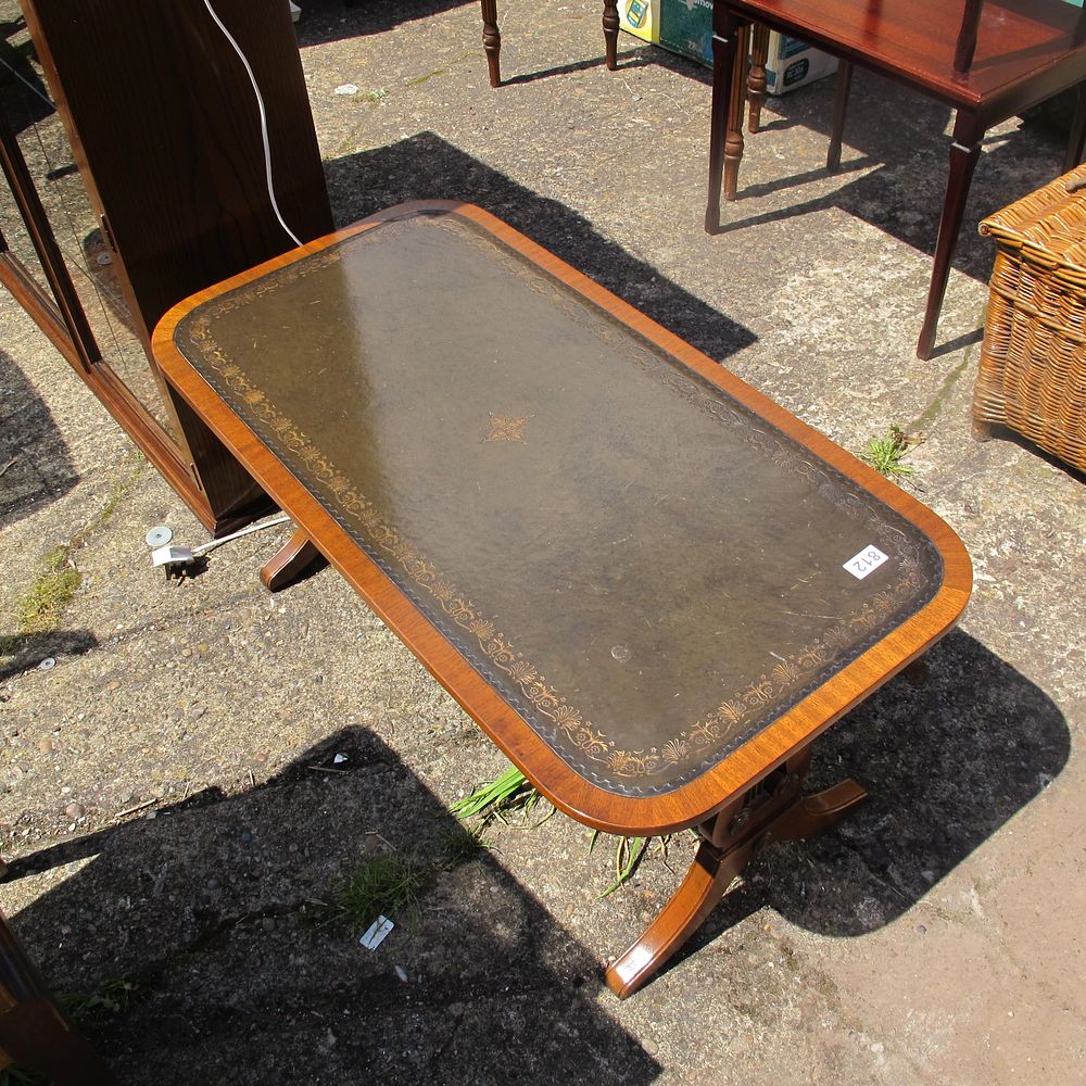 Lot 812: leather topped coffee table