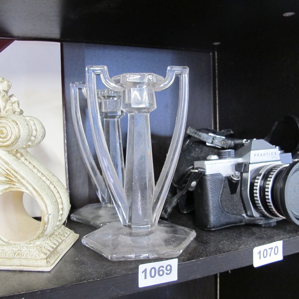 Lot 1069: Pair of glass candle sticks 
