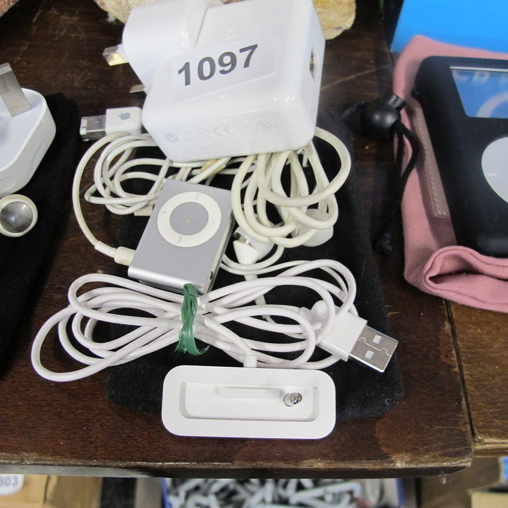 Lot 1097: iPod shuffle, charger and charging port 