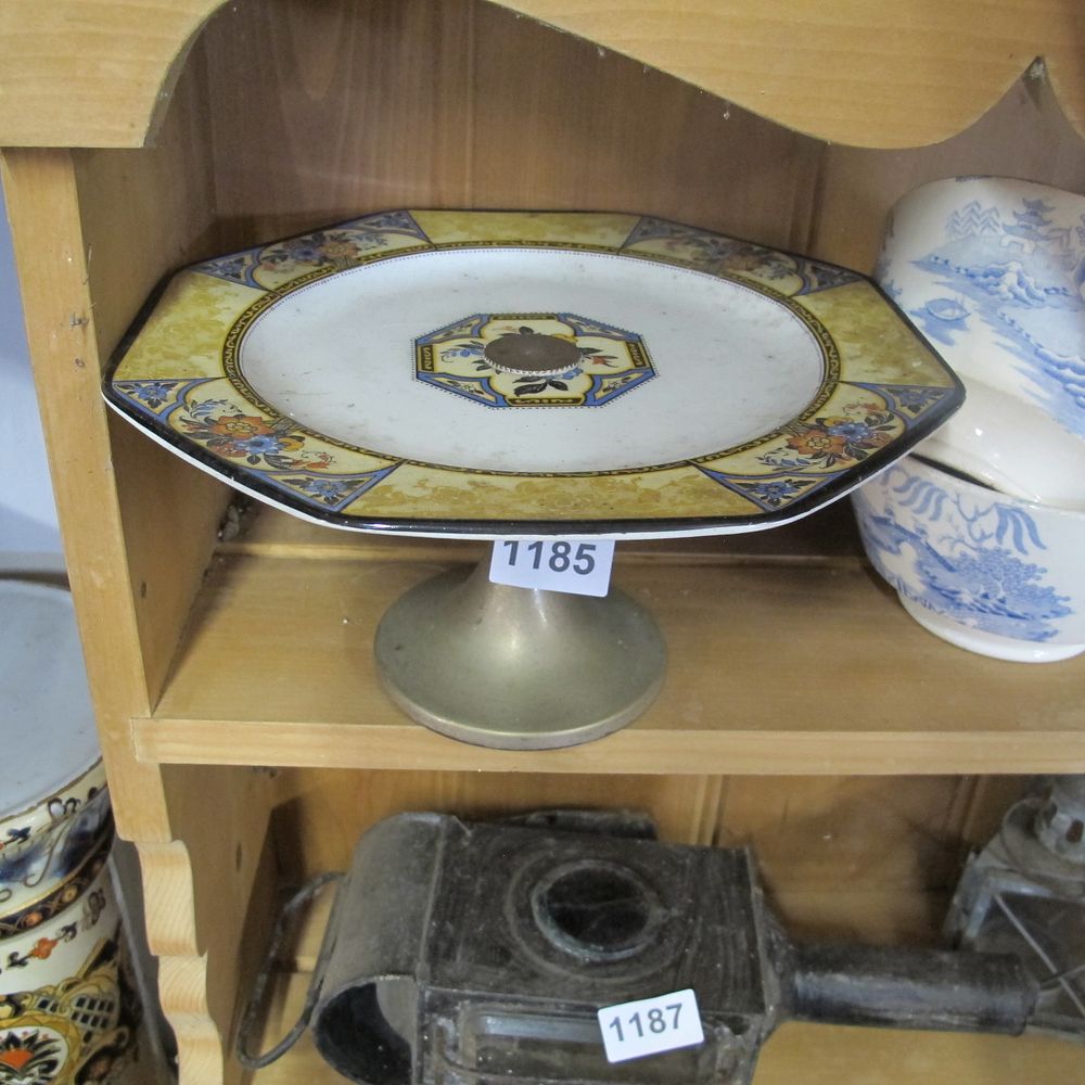 Lot 1185: Ceramic and metal cake stand 