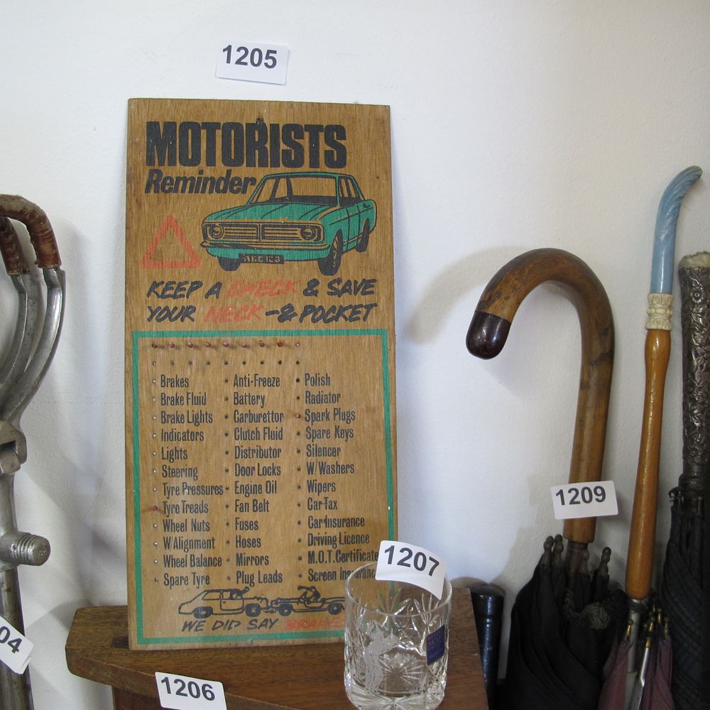 Lot 1205: Wooden motorist reminder wall hanging sign
