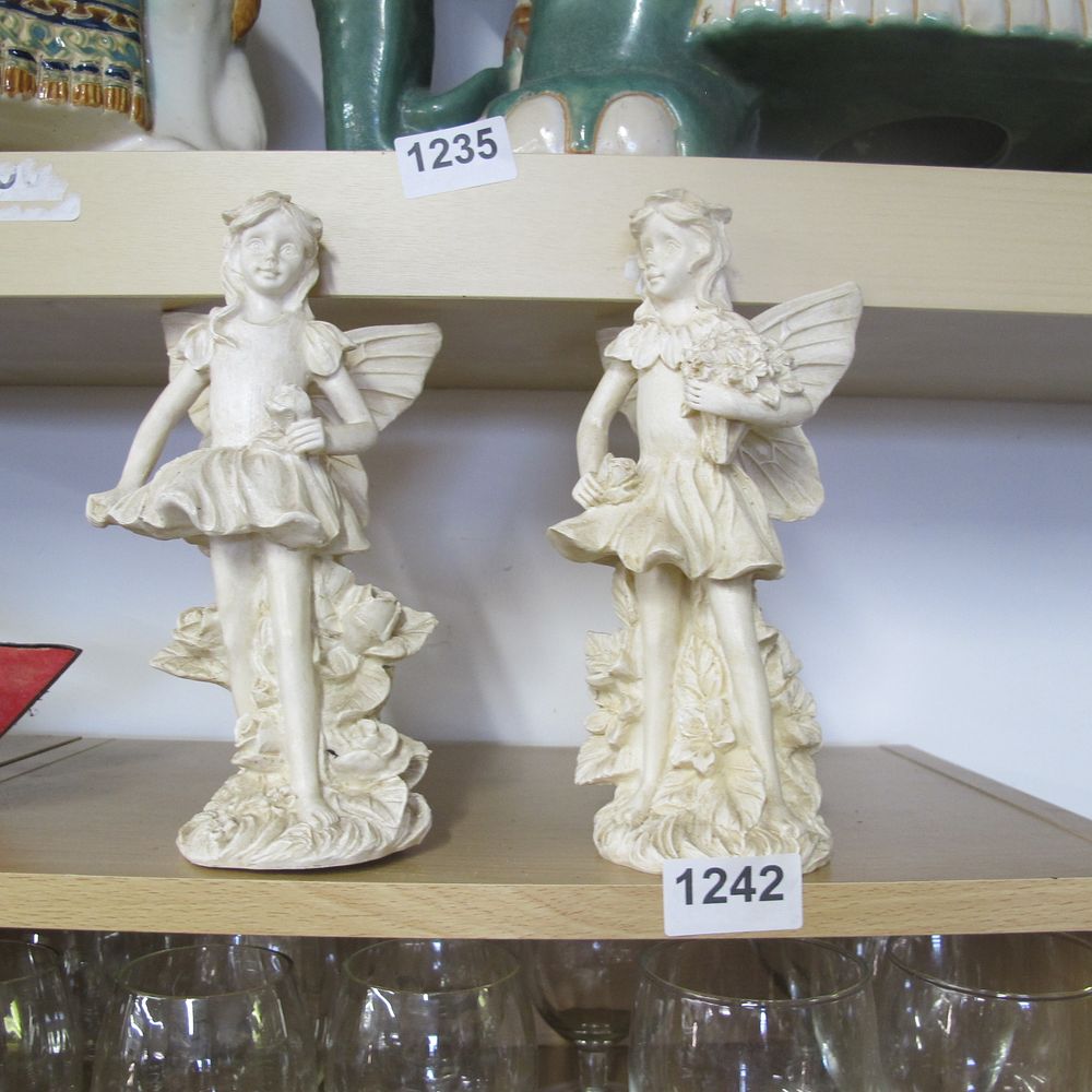Lot 1242: Two fairy ornaments 