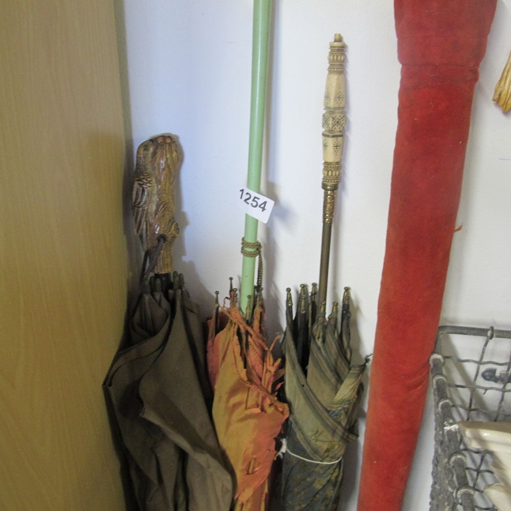 Lot 1254: Various ornately handled umbrellas 