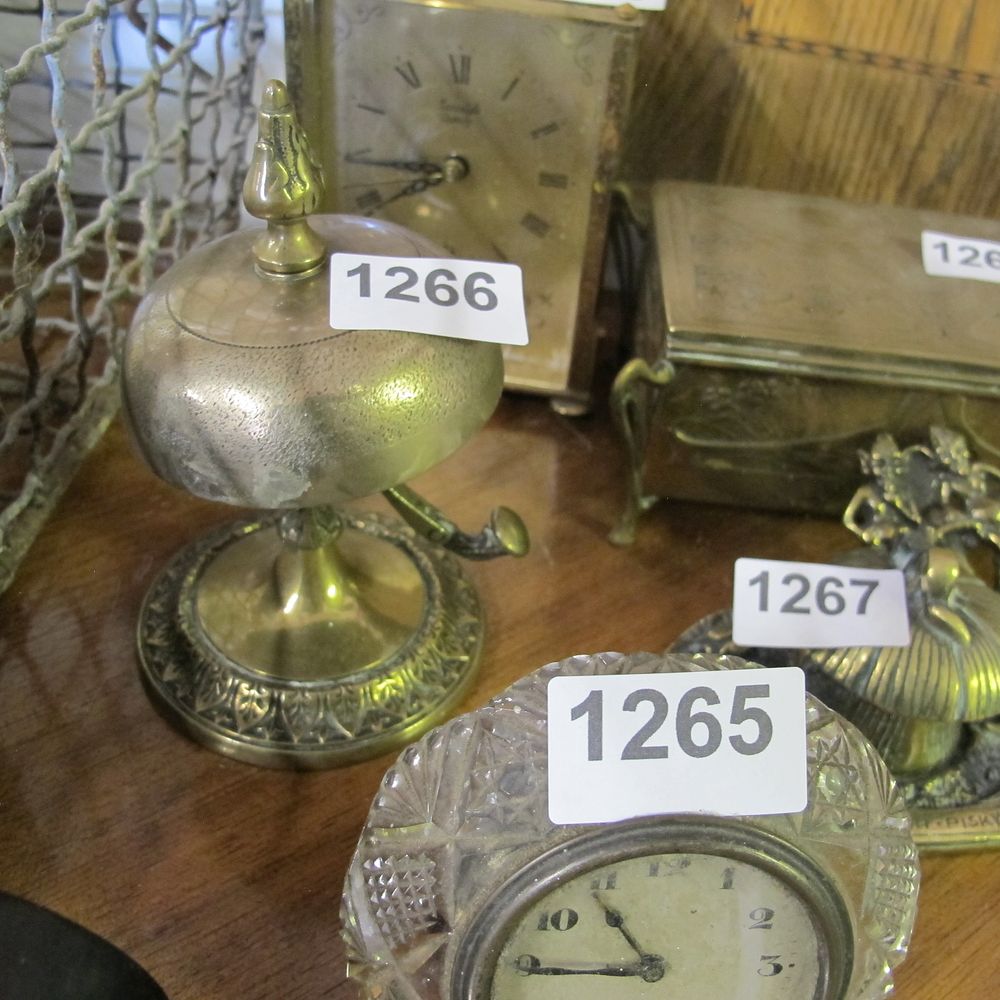 Lot 1266: Antique brass bell ringer