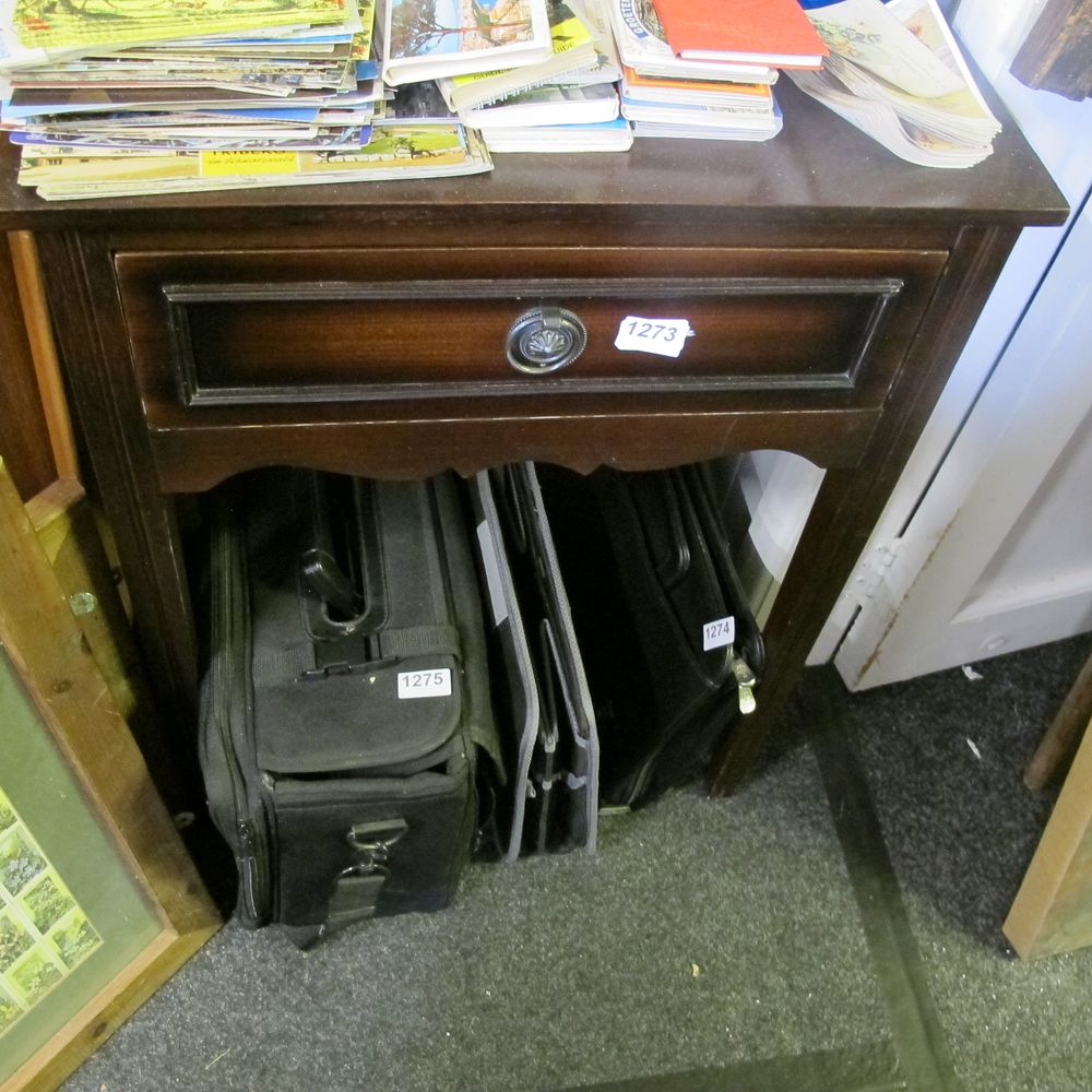 Lot 1273: A wooden side table With storage draw