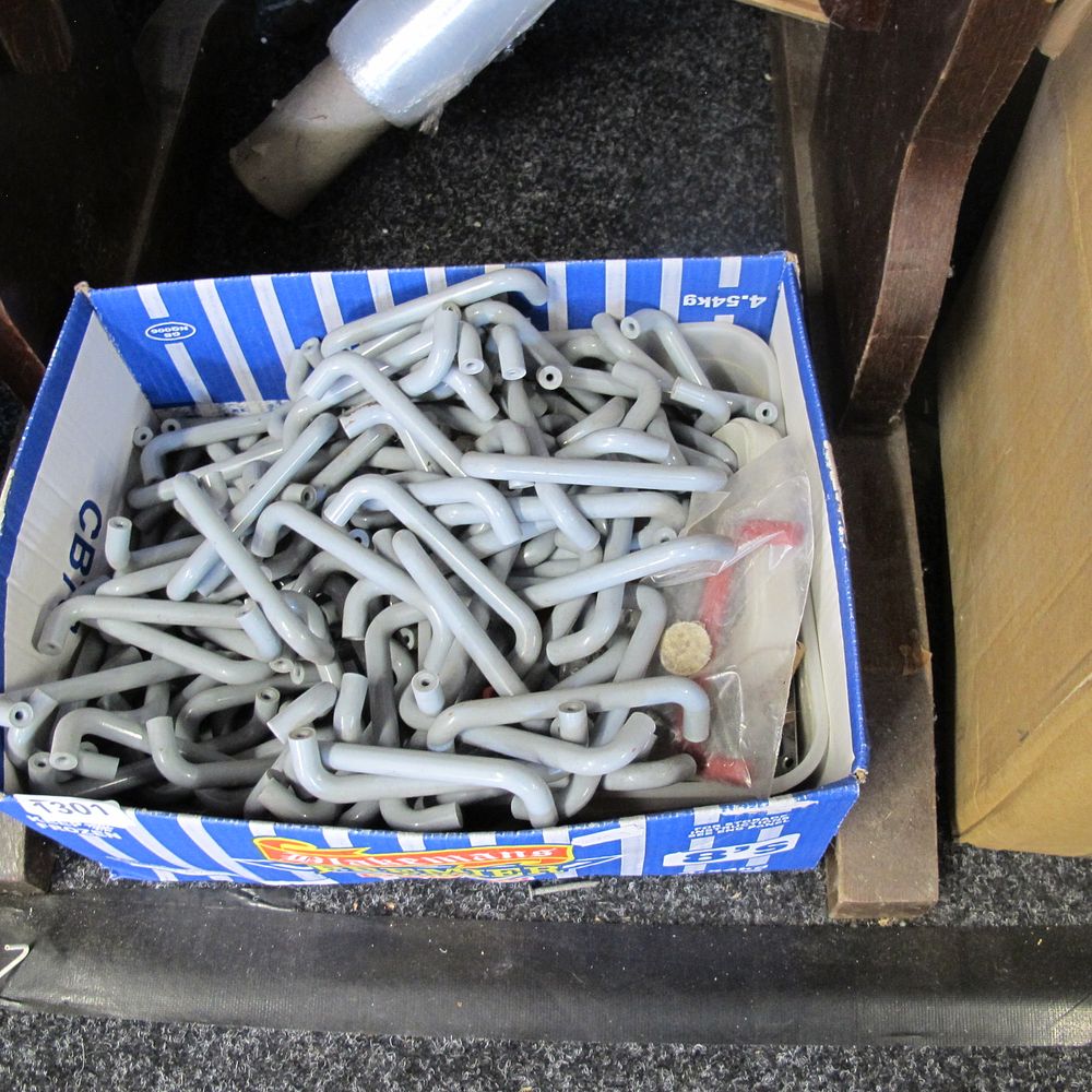 Lot 1301: A tube of plastic handles
