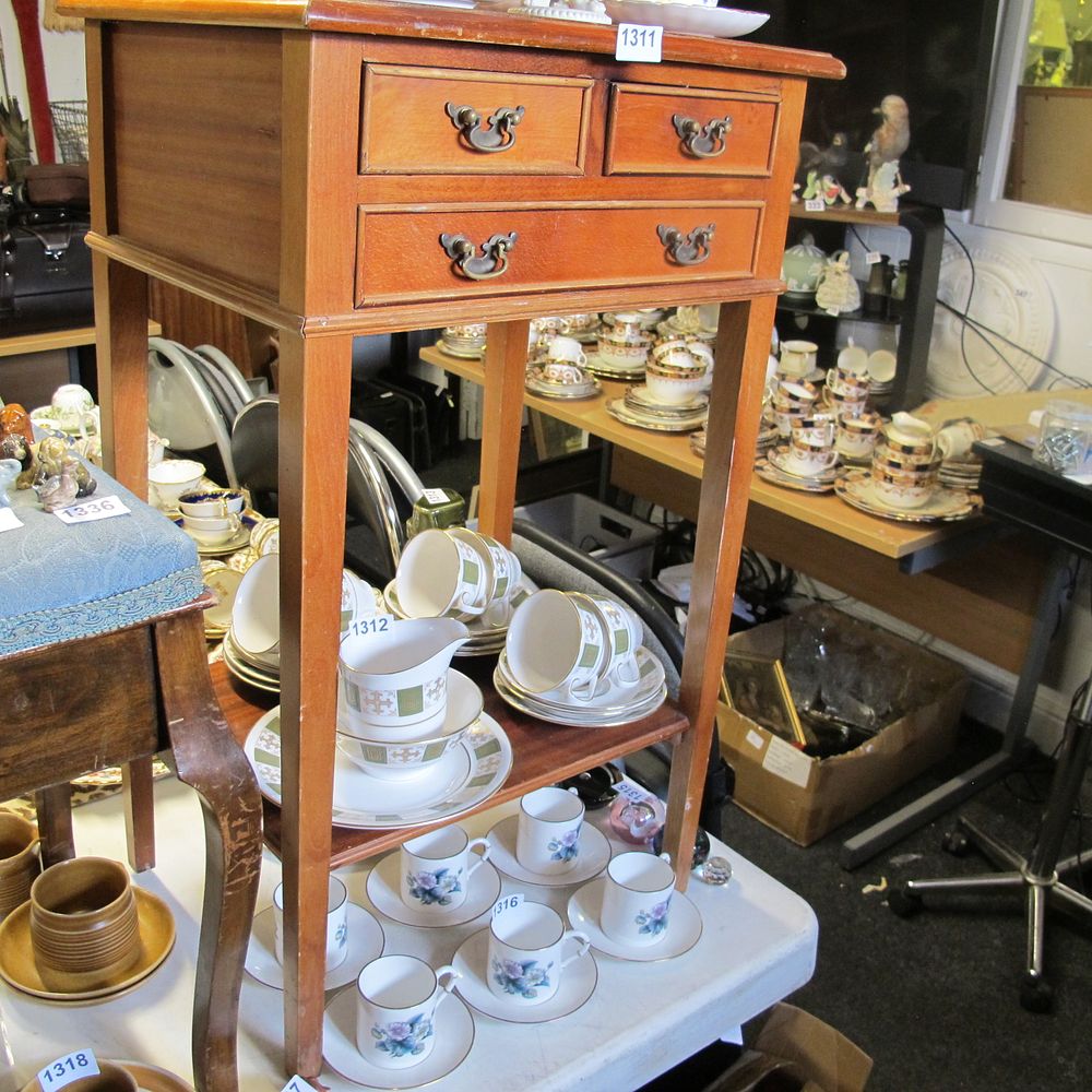 Lot 1311: a long legged side table with two over...