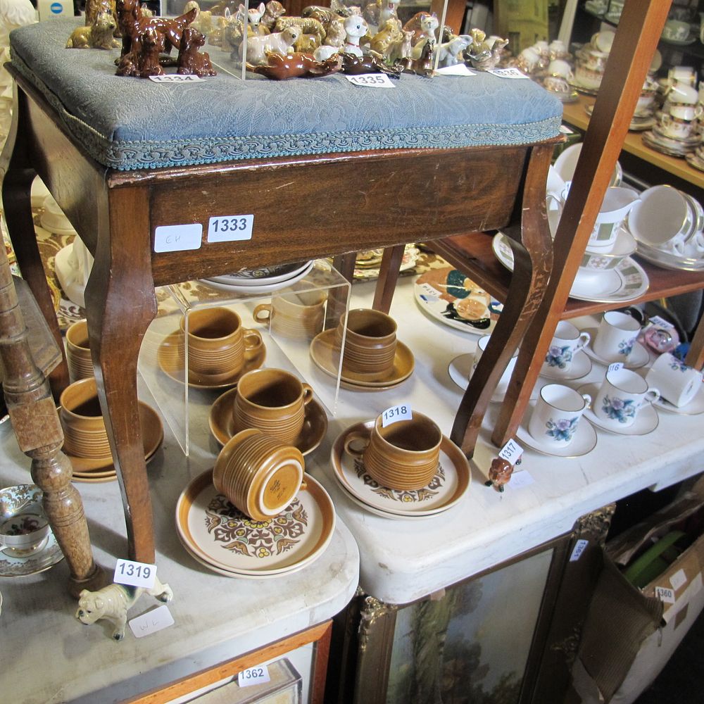 Lot 1333: A vintage piano stool with sheet music magazines...