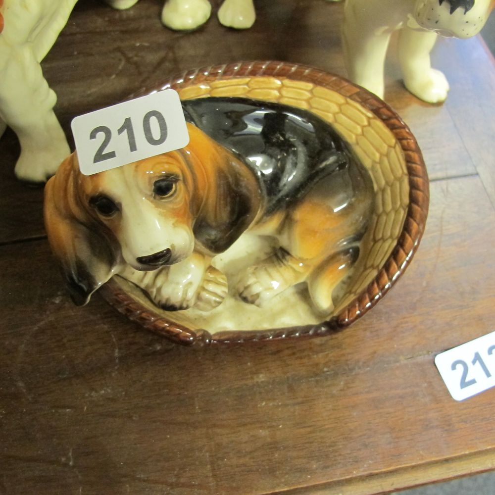 Lot 210: Dog in basket ceramic 