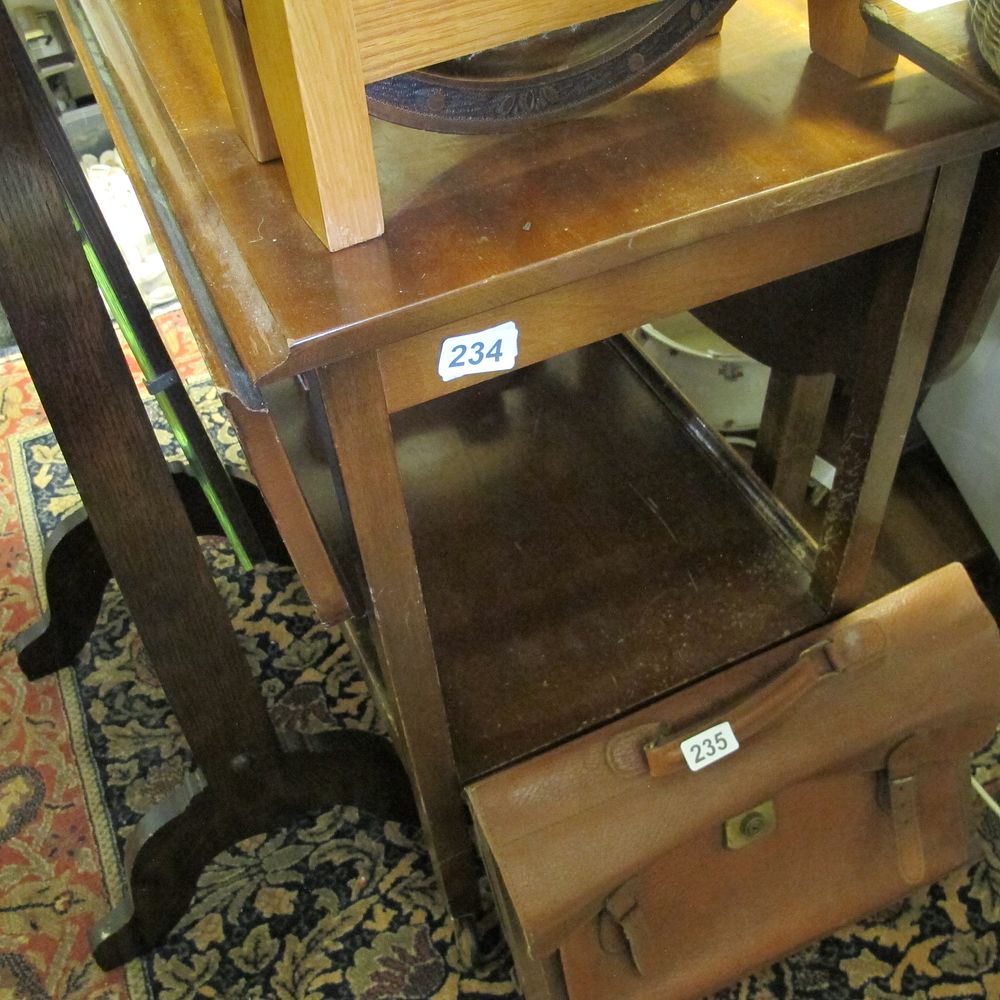 Lot 234: Wooden table with drop leaf shelf either side