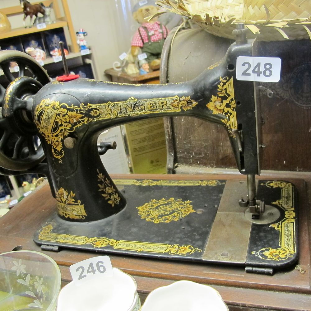 Lot 248: Singer swing machine with wooden case 
