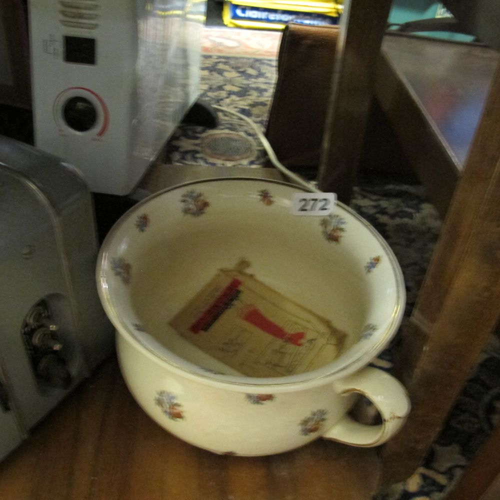 Lot 272: Floral motif ceramic chamber pot still stinks of...