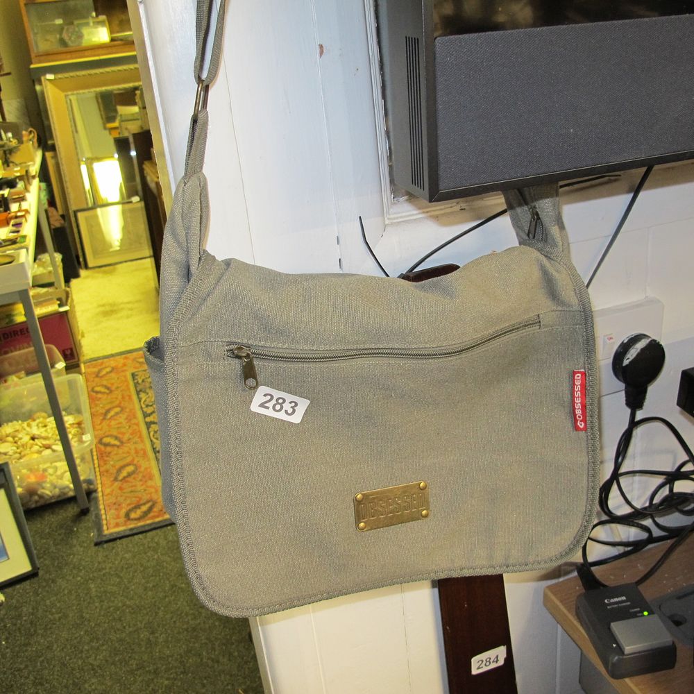 Lot 283: Obsessed over the shoulder man bag 