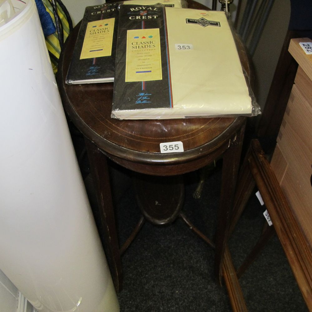 Lot 355: Oval wooden table with shelf 