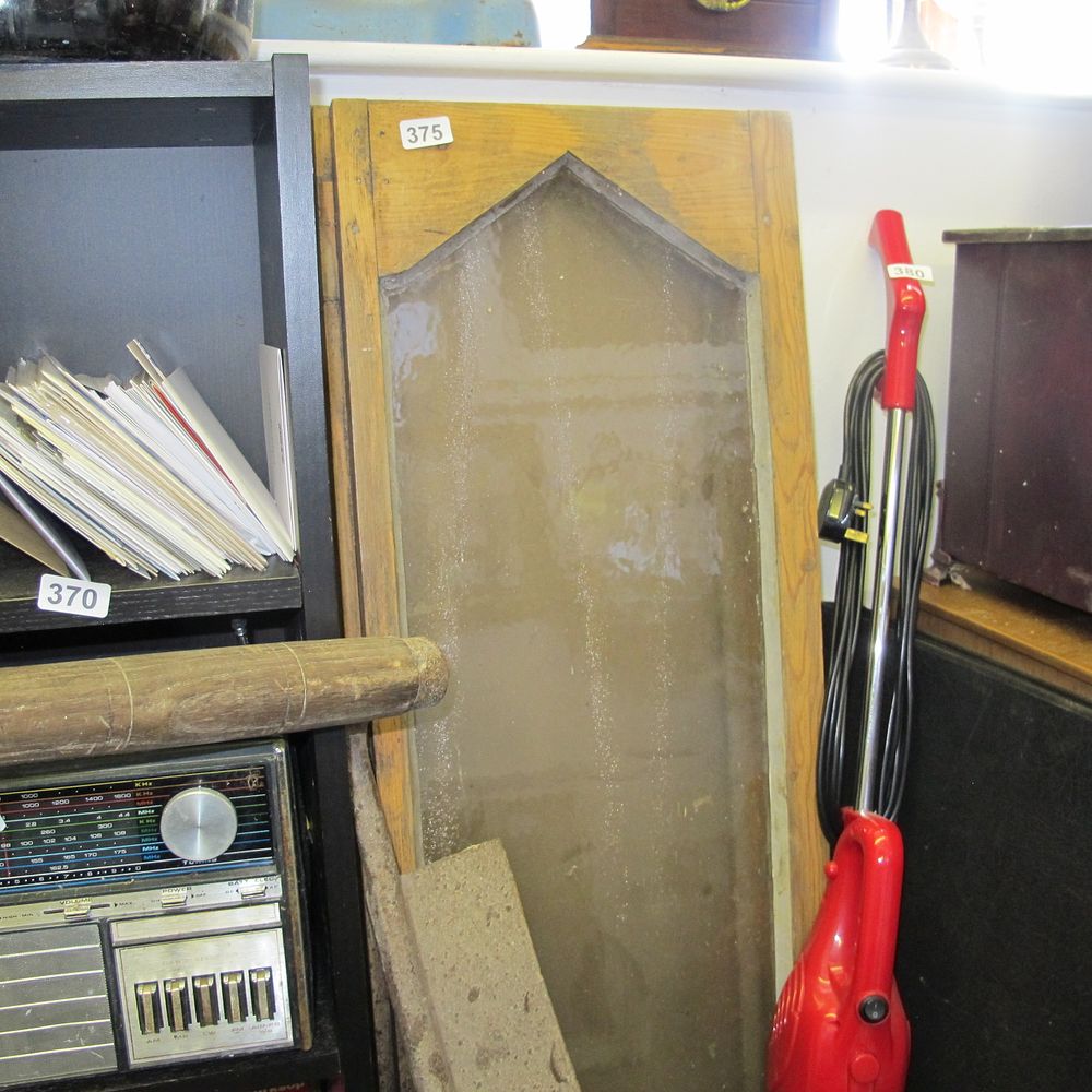 Lot 375: two reclaimed wooden panels that make up window...