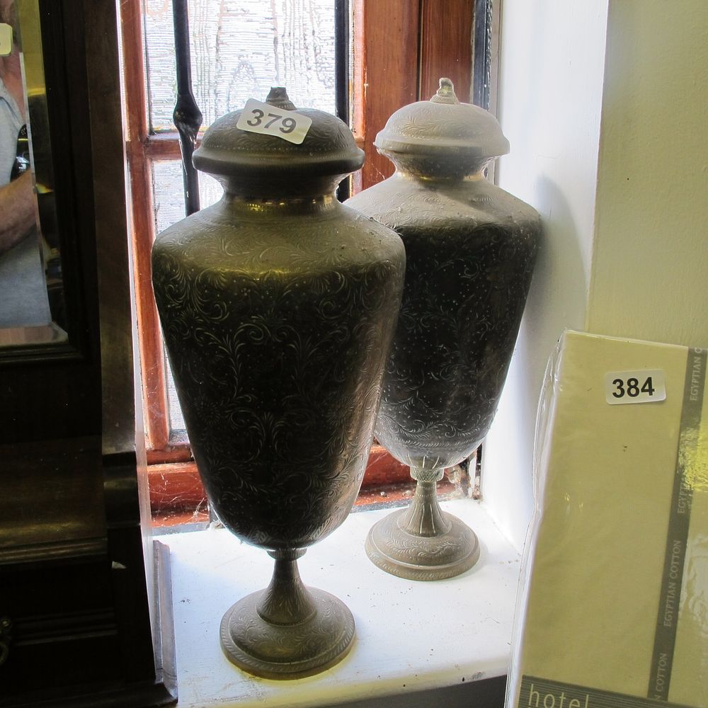 Lot 379: Pair of brass urns 