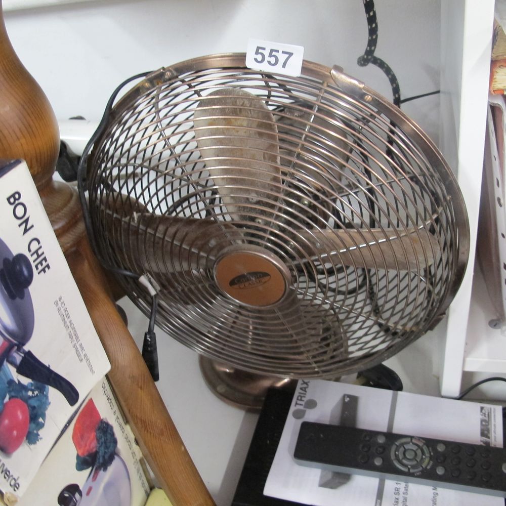 Lot 557: Brass effect desk fan