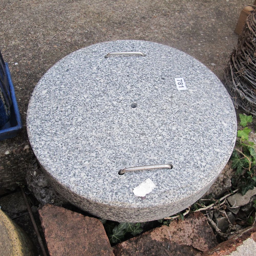 Lot 781: heavy marble weight to tie down garden umbrellas