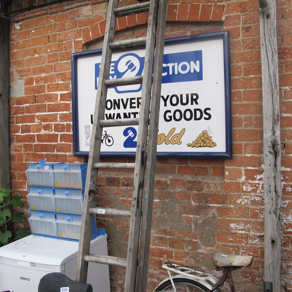 Lot 807: set of long wooden ladders