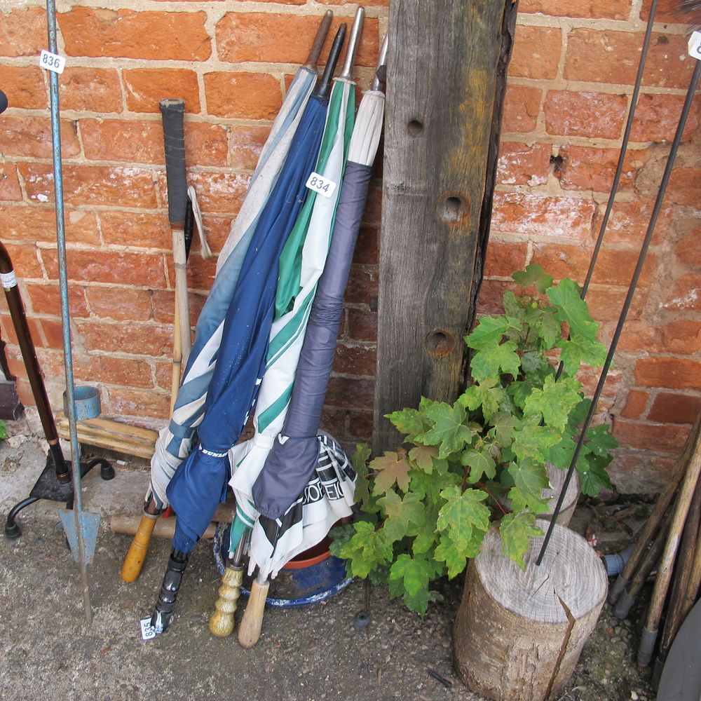 Lot 834: three golfing umbrellas