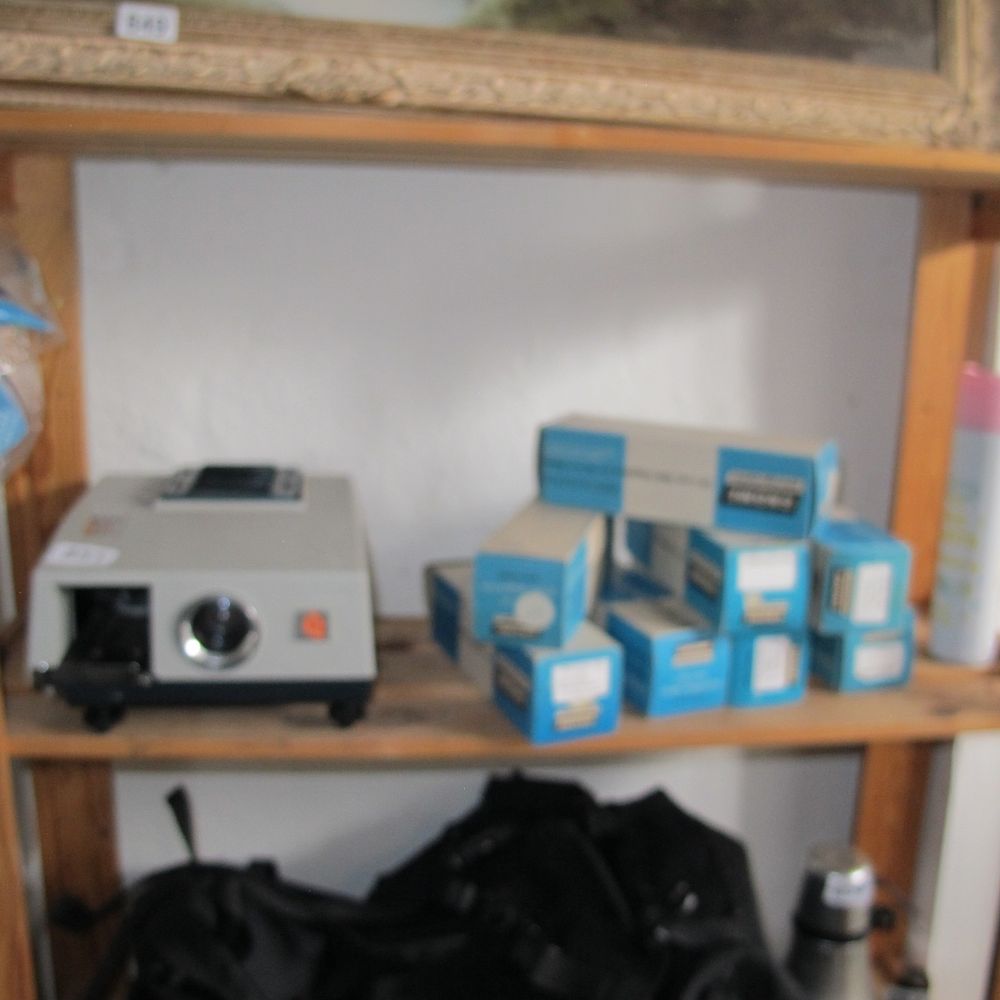 Lot 851: slide projector and slides