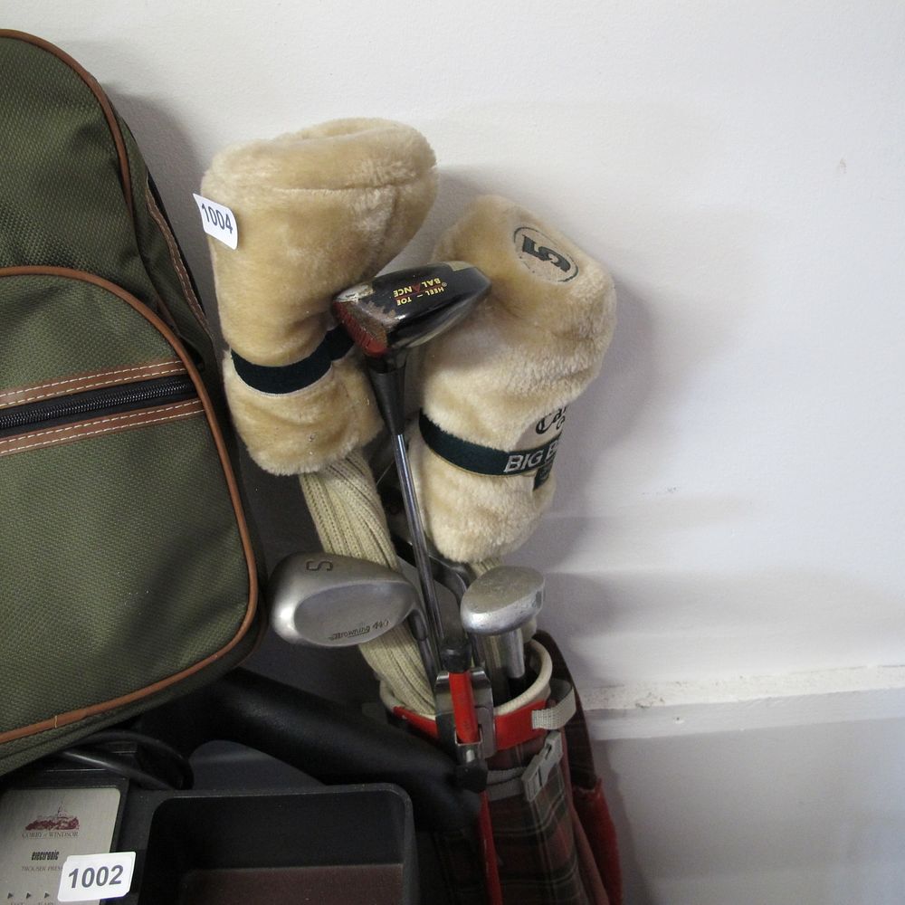 Lot 1004: Bag of golf clubs and covers 