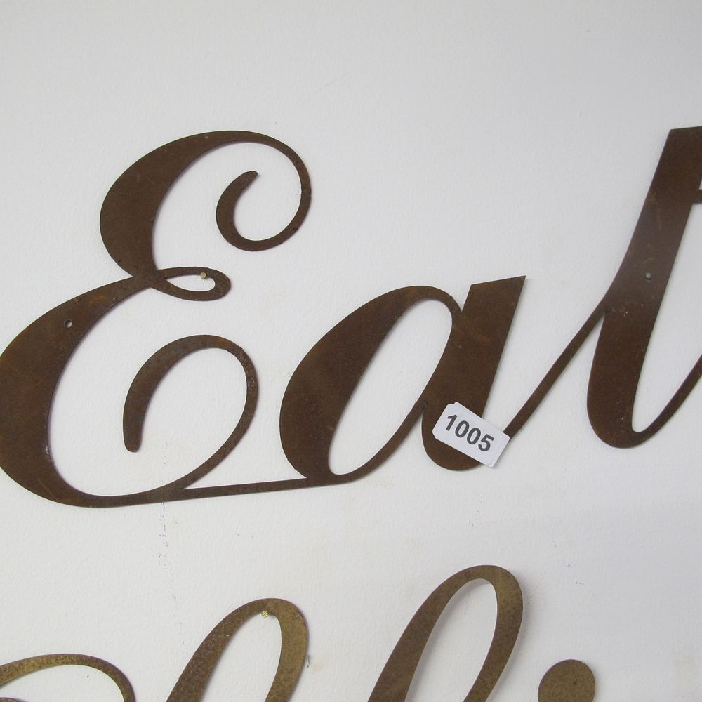 Lot 1005: Metal wall hanging ‘Eat’ sign 
