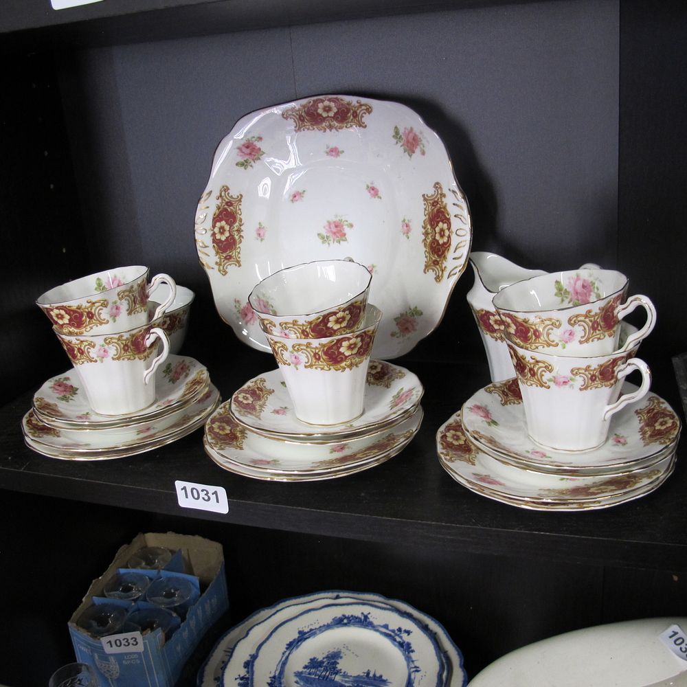 Lot 1031: Rose motif chine to include 6 teacup trios...