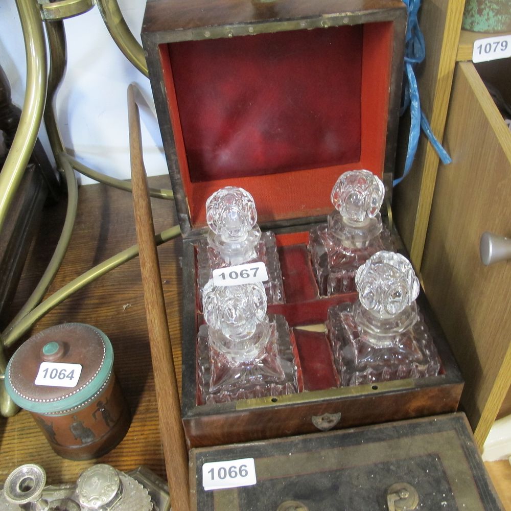 Lot 1067: Lined wooden box with four decanters 