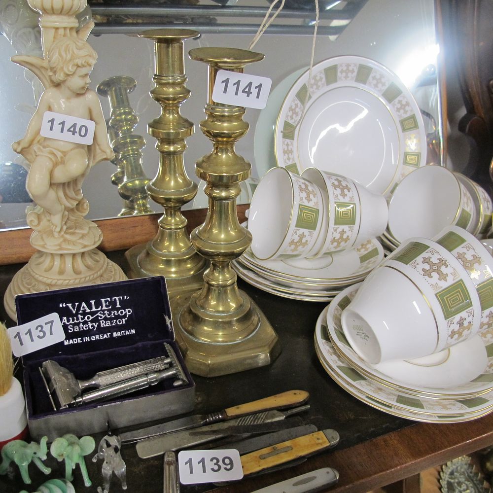 Lot 1141: Pair of brass candlesticks