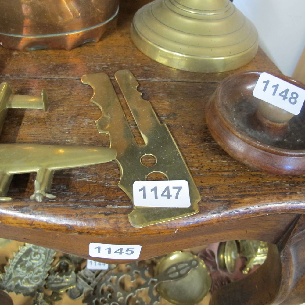 Lot 1147: Brass button aid