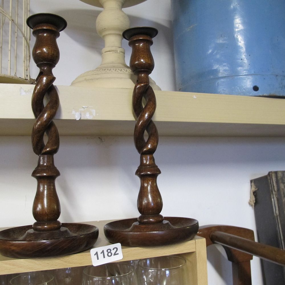 Lot 1182: 2 wooden twist candle sticks