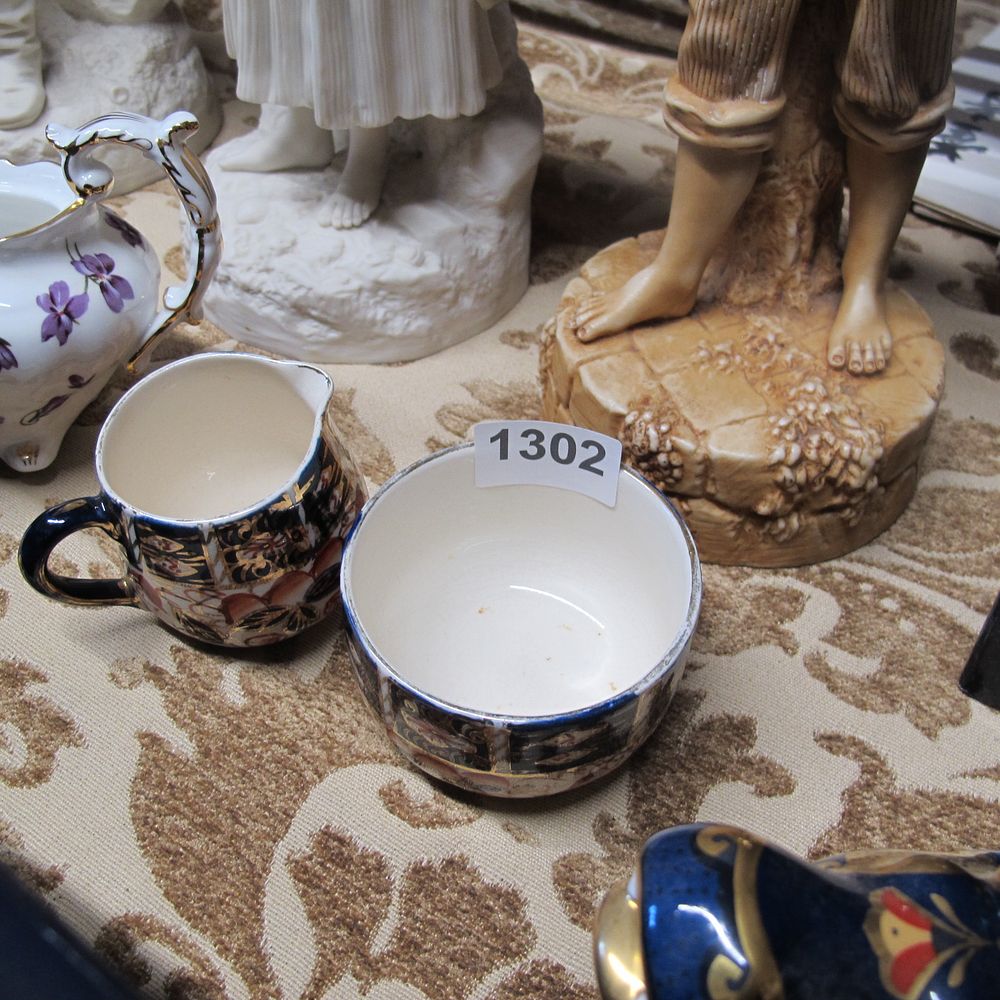 Lot 1302: Milk jug and sugar bowl