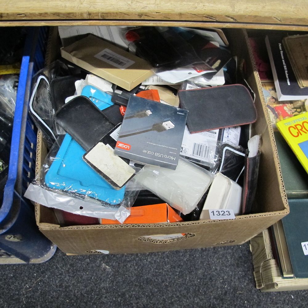 Lot 1323: Box of misc phone accessories 