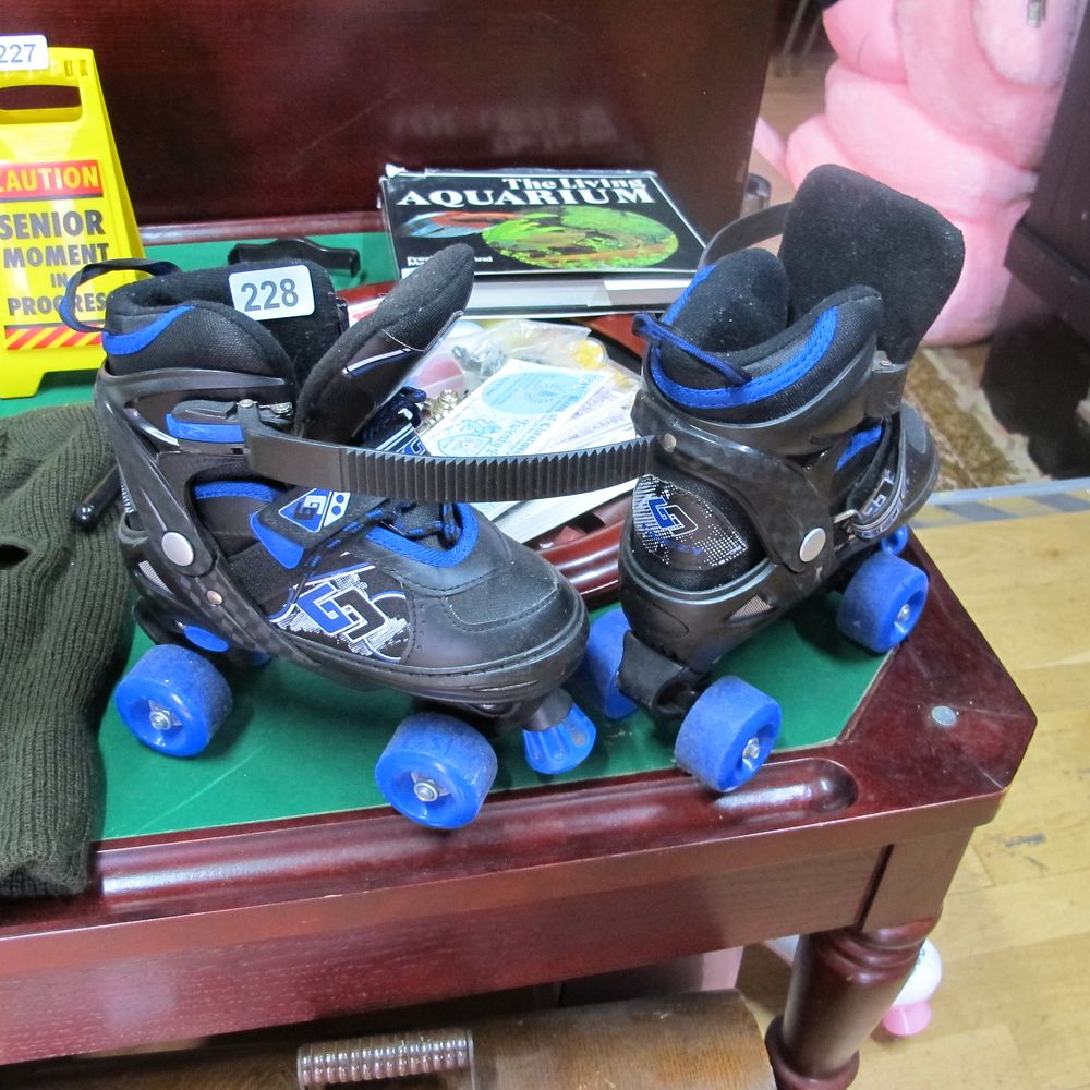 Lot 228: kids roller boots