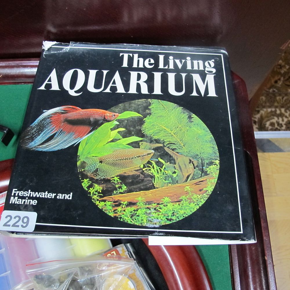 Lot 229: The living aquarium book written by Elliot's uncle
