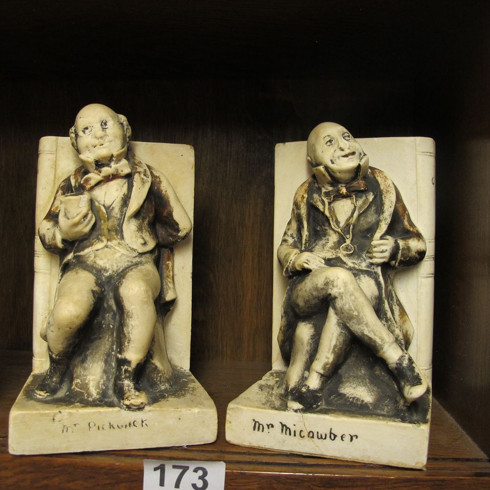 Lot 173: a pair of bookends of Dickens characters Mr...
