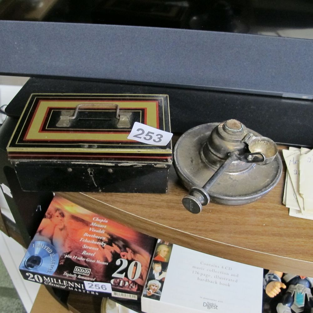 Lot 253: metal cash tin