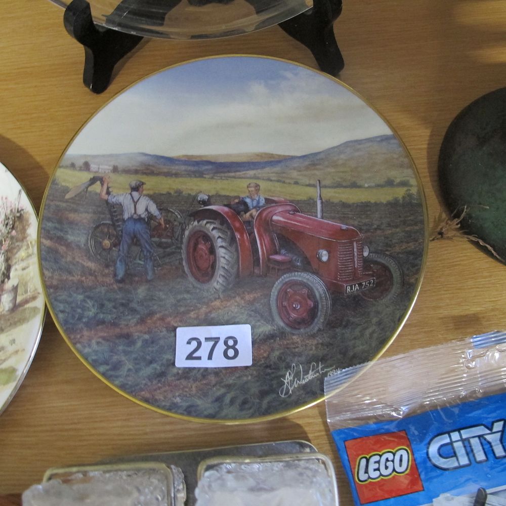 Lot 278: Porcelain plate featuring farmer with tractor