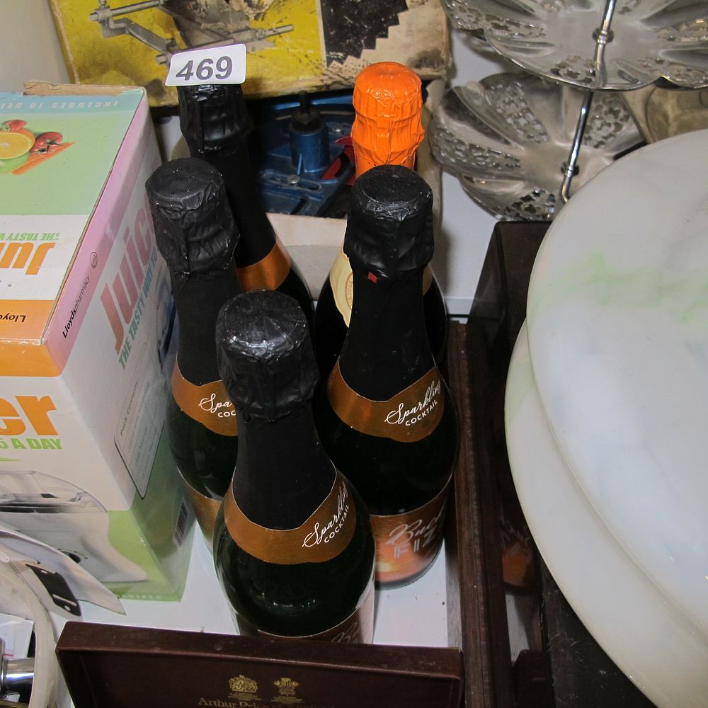 Lot 469: bottles of bucks fizz well out of date