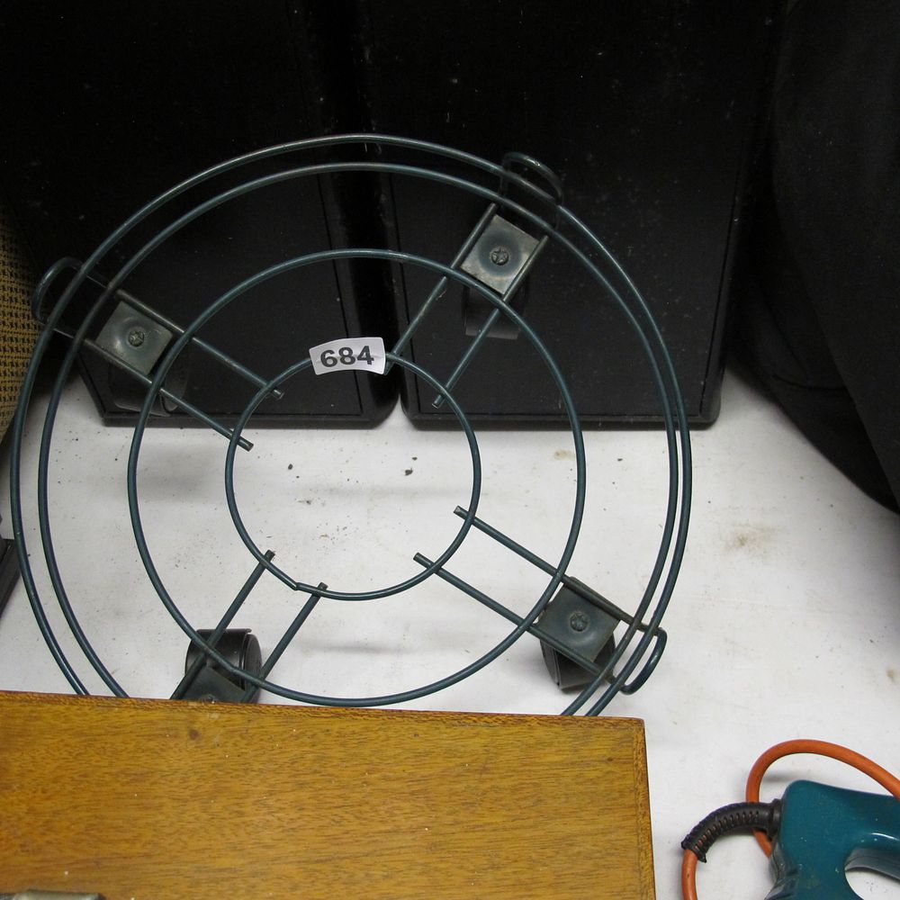 Lot 684: Plant stand on wheels