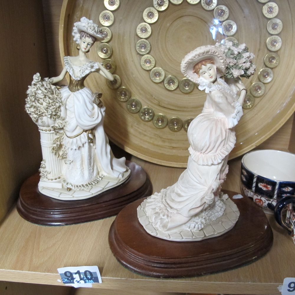 Lot 910: Pair of lady figurines