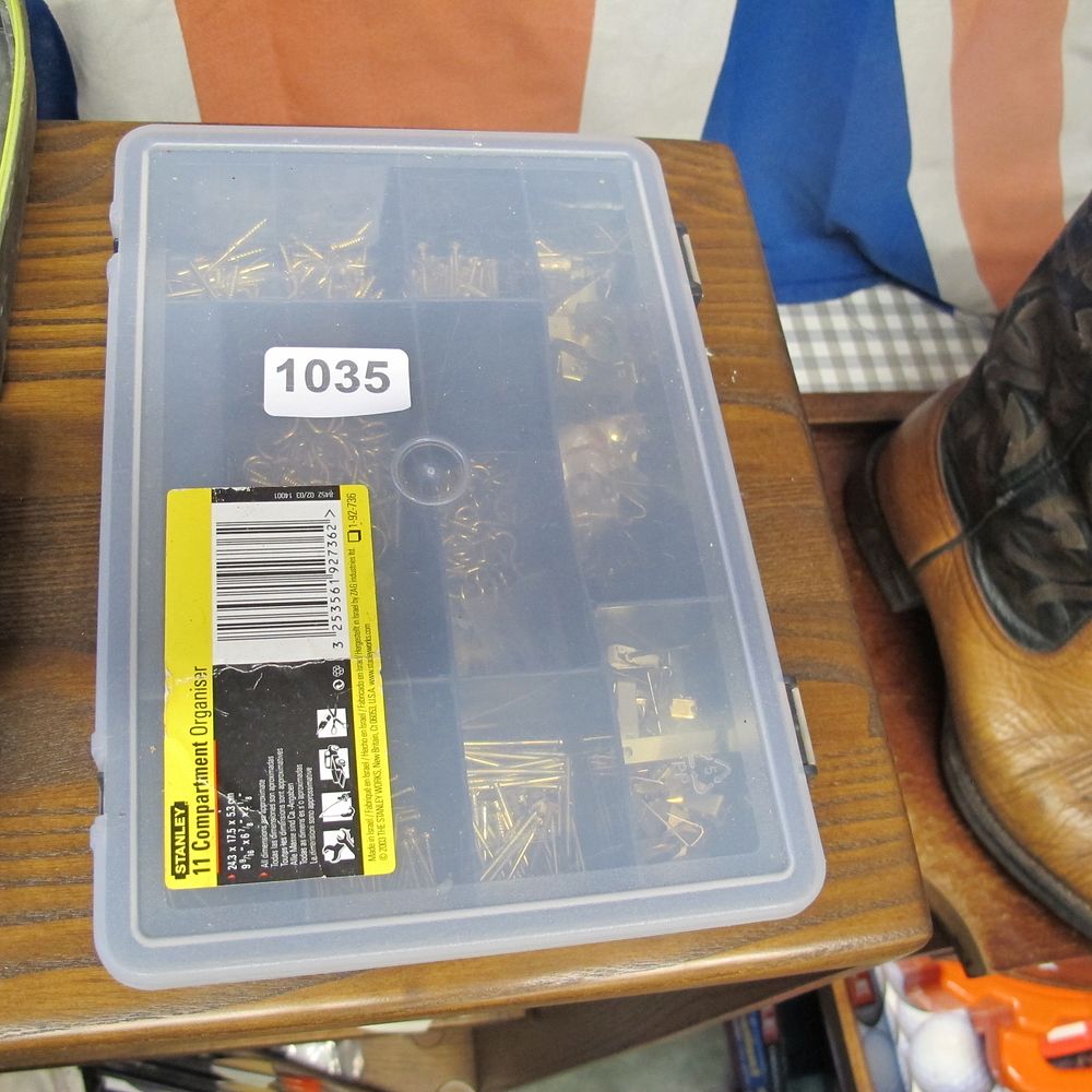 Lot 1035: Stanley box of picture hanging brackets etc