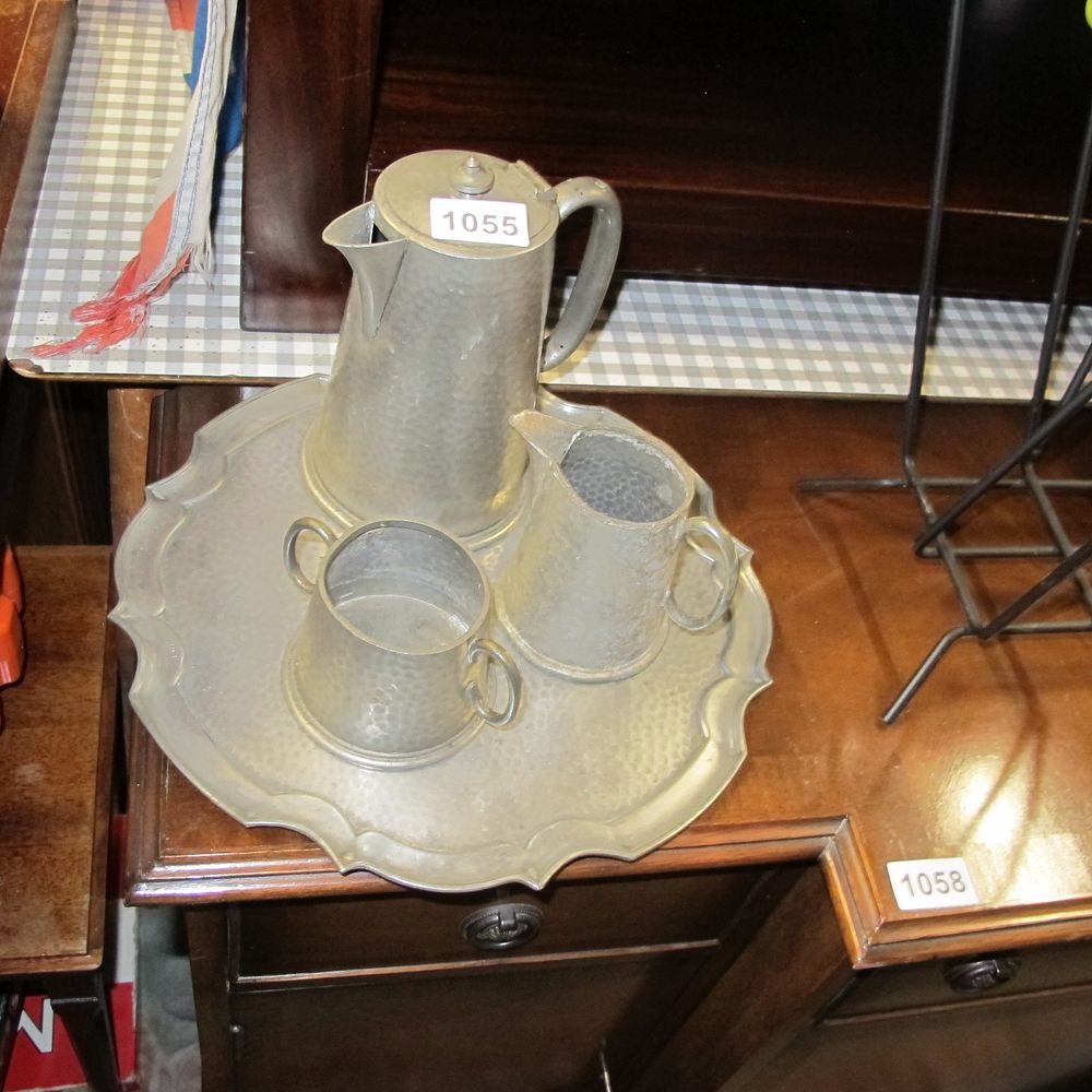 Lot 1055: Hand beaten pewter coffee set with tray