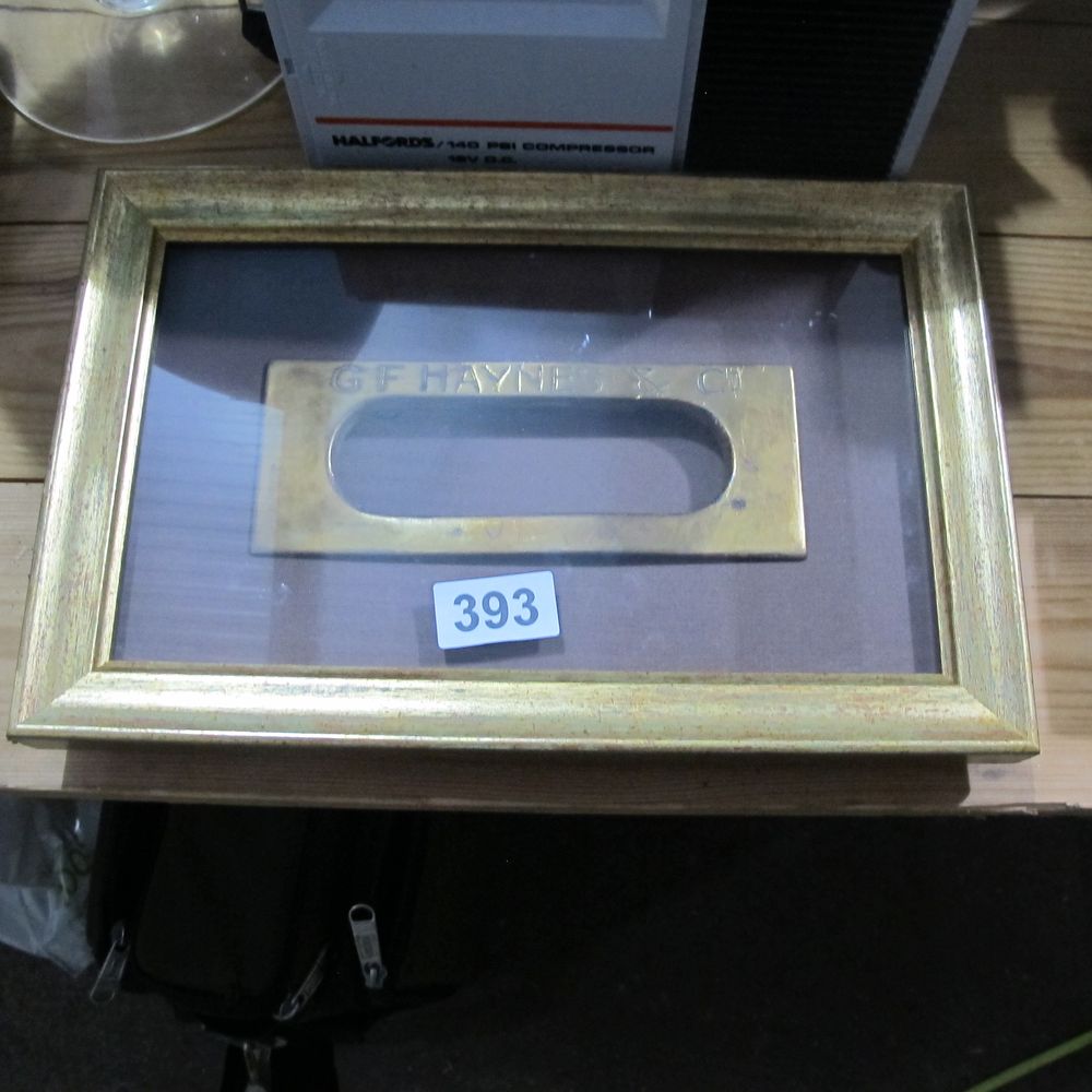Lot 393: Framed and glazed brass letter box