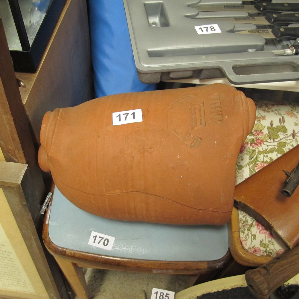 Lot 171: a large terracotta chicken cooking pot