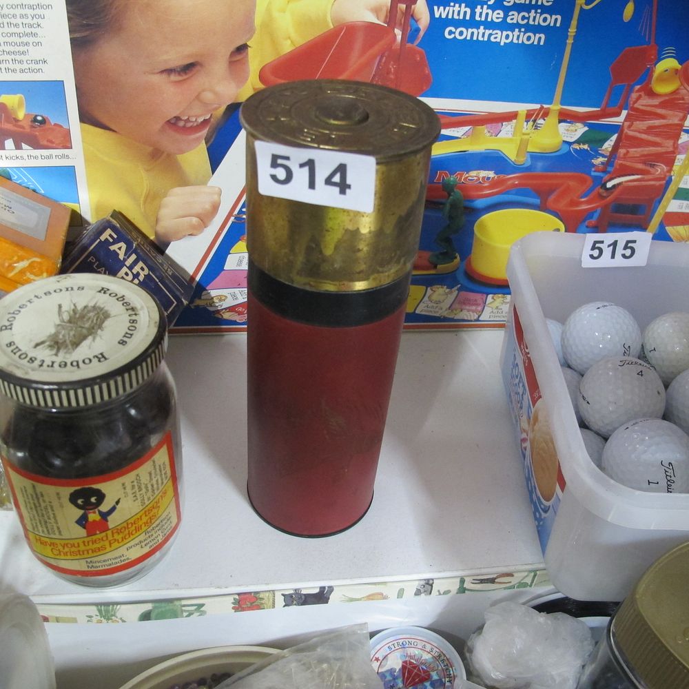 Lot 514: oversized shot gun cartridge