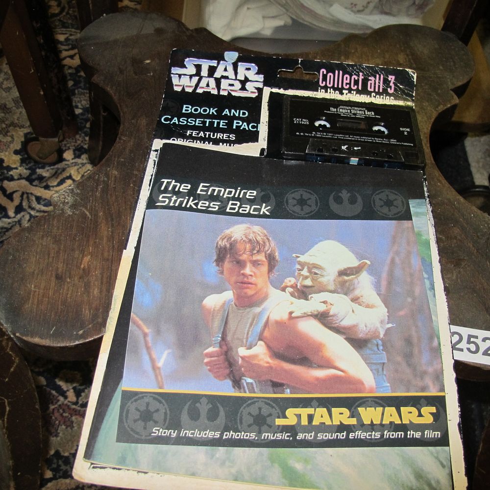 Lot 252: Star Wars Empire Strikes Back book and cassette...